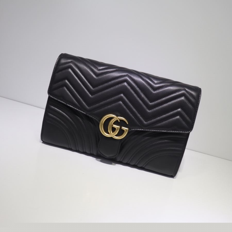G*u*i clutch bags